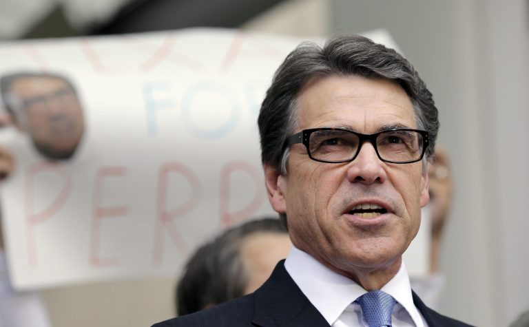 Texas Gov. Rick Perry talks to the media and supporters after he was booked at the Blackwell Thurman Criminal Justice Center on Tuesday in Austin. (AP Photo/Eric Gay)