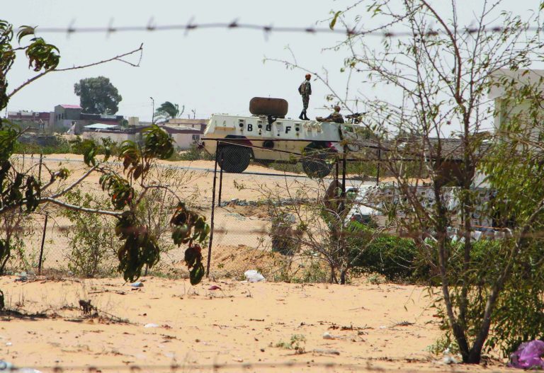 Egyptian border guards patrol near the border with Israel in Rafah, Egypt, Monday Aug. 6, 2012. Egypt deployed helicopter gunships to the Sinai Peninsula on Monday to hunt for the militants who killed at least 16 soldiers Sunday when the troops at a checkpoint were having the traditional meal at the end of the daily fast during the Muslim holy month of Ramadan. (AP Photo/Ahmed Gomaa)