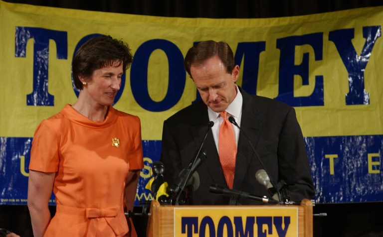 U.S. Rep. Pat Toomey, R-Pa., right, stands with his wife, Kris, left, as he gives his concession speech at his election night headquarters in Trexlertown, Pa., early Wednesday, April 28, 2004. (AP Photo/Chris Gardner)