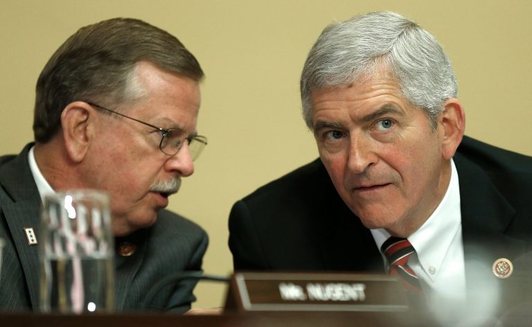 Rep. Daniel Webster, right, and Rep. Richard Nugent confer while constitutional lawyers testify at a House Rules Committee hearing July 16, 2014 at the U.S. Capitol in Washington. (Photo by Win McNamee/Getty images)