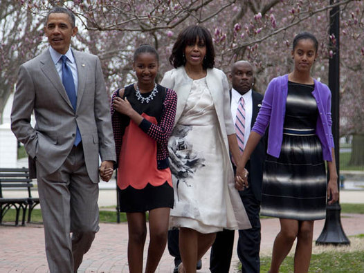 President Barack Obama and first lady Michelle Obama walk from the White House with their daughters Sasha Obama, second from left, and Malia Obama, right, on their way through Lafayette Park to St. John's Episcopal Church for Easter services. (AP Photo/Carolyn Kaster)