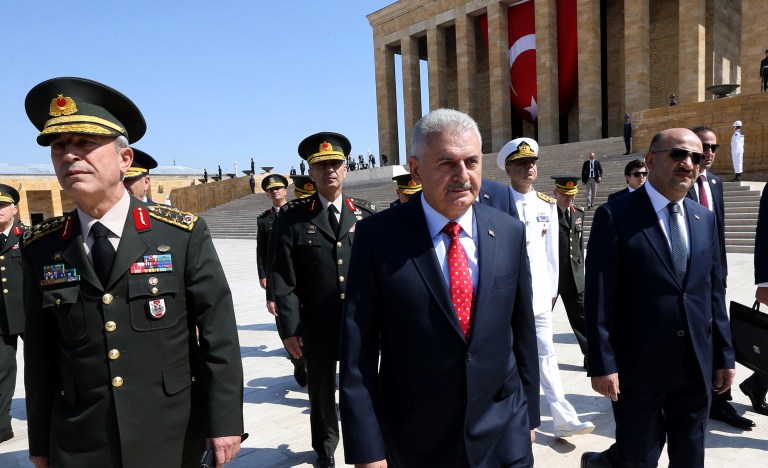 More than 40,000 people have been detained in Turkey amidst ongoing federal investigations to uncover individuals and groups behind last month's failed coup to remove President Recep Tayyip Erdogan from office, Prime Minister Binali Yildirim (pictured above, center) said Wednesday. (Hakan Goktepe/Pool Photo via AP)