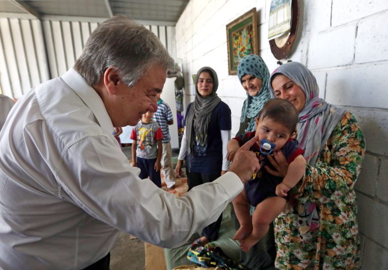 United Nations High Commissioner for Refugees (UNHCR) Antonio Guterres greets a Syrian child during his visit to Khaldeh, south of Beirut, Lebanon, Thursday, June 19, 2014. Guterres is visiting Lebanon where he will meet some Syrian refugees and discuss the situation with Lebanese officials. Lebanon, home to 4.5 million people, is struggling to cope with the presence of more than 1 million refugees in desperate need of housing, education and medical care. (AP Photo/Bilal Hussein)