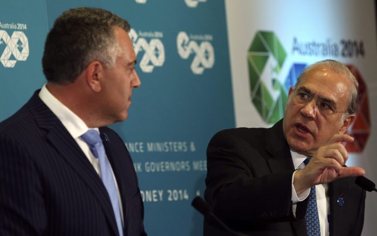 Secretary-General of Organization for Economic Co-operation and Development Angel Gurria, right, speaks with Australia's Treasurer Joe Hockey during the G20 Finance Ministers and Central Bank Governors meeting in Sydney, Australia, Friday, Feb. 21, 2014.(AP Photo/Rob Griffith)