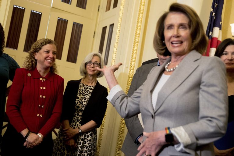 House Minority Leader Nancy Pelosi of Calif., right, recognizes Rep. Debbie Wasserman Schultz, D-Fla., left, during a news conference on American labor on Capitol Hill in Washington, Wednesday, Nov. 1, 2017. On Thursday in Florida, the two ripped corporations giving employees tax reform bonuses. (AP Photo/Andrew Harnik)