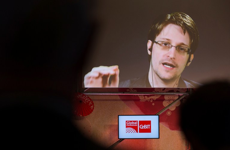 Edward Snowden, a former CIA worker before turning whistleblower, speaks via satellite at the IT fair CeBIT in Hanover, Germany, Tuesday. ( Friso Gentsch/dpa via AP)