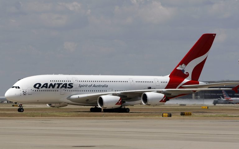 In this Sept. 29, 2014 photo released by Qantas, an Airbus A380 taxis to its gate during its inaugural landing at Dallas-Fort Worth International Airport in Texas, Monday, Sept. 29, 2014. Qantas is putting the world's biggest passenger plane on the world's longest airline route. The Airbus A380 touched down Monday at Dallas-Fort Worth International Airport, about 15 hours after leaving Sydney, Australia, on the 8,578-mile journey. (AP Photo/Qantas, Brandon Wade)