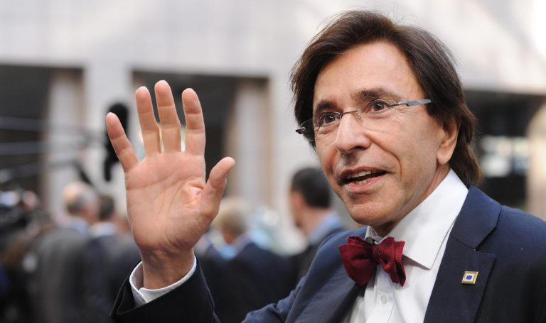 FILE In this March 20, 2014 file photo, Belgian Prime Minister Elio Di Rupo waves as he arrives for an EU summit in Brussels. Walk through Belgium and feel that giddy sense of unity, the national football team is going to the World Cup again. Follow the election campaign though, and the division between Dutch- and French-speakers seems even worse than four years ago when it took a record 541 days to form a government uniting the bickering sides. (AP Photo/Eric Vidal, file)