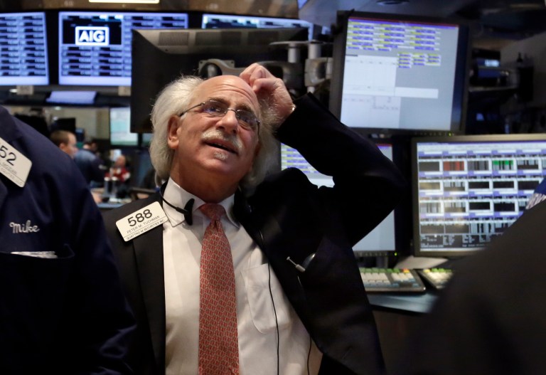 Trader Peter Tuchman works on the floor of the New York Stock Exchange, Monday, March 3, 2014. Global stock markets are down sharply on tensions over Russia's military advance into Ukraine and the threat of sanctions by Western governments. (AP Photo/Richard Drew)