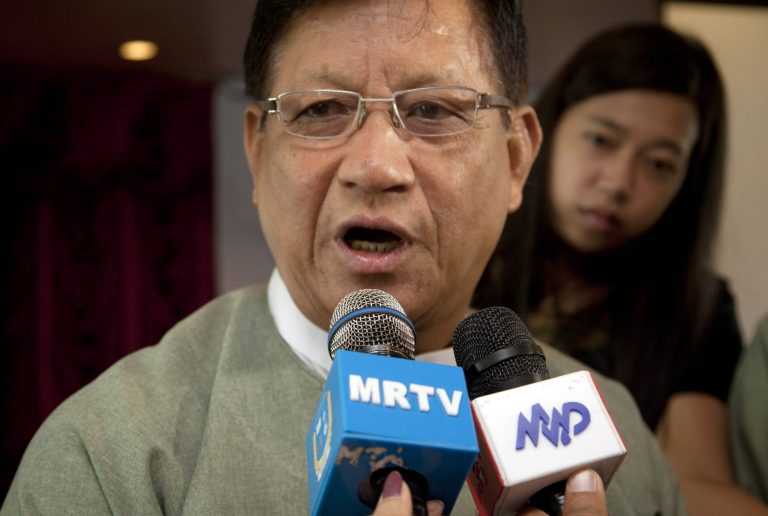 Tin Aye, chairman of Myanmar Union Election Commission, talks to journalists as he attends coordination and cooperation workshop of Union Election Commission and political parties at a hotel Tuesday, Oct 21, 2014, in Yangon, Myanmar. Tin Aye made the announcement at a meeting with political party members in Yangon. He said international and local observers would be invited to witness the election, to be held in late October or early November of next year. (AP Photo/Khin Maung Win)