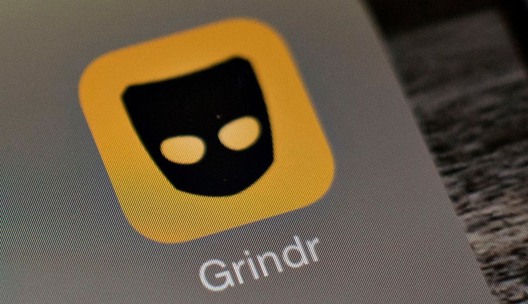 Gay dating app Grindr is displayed for a photograph on an Apple iPhone in Tiskilwa, Ill., on Tuesday, Jan. 20, 2015.
