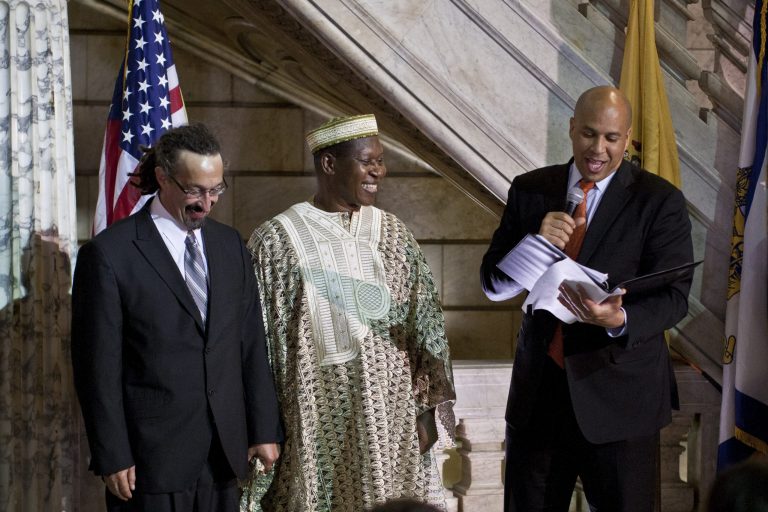 Newark Mayor and newly-elected Sen. Cory Booker, right, officiates a wedding ceremony for James Credle, middle, and Pierre DuFresne at City Hall in the early morning hours of Oct. 21 in Newark, New Jersey.ÃÂ Just hours after Booker officiated the state's first legal same-sex wedding ceremonies, Gov. Chris Christie announced Monday he is dropping his appeal of the court ruling that allowed such unions.ÃÂ (Photo by Kena Betancur/Getty Images)
