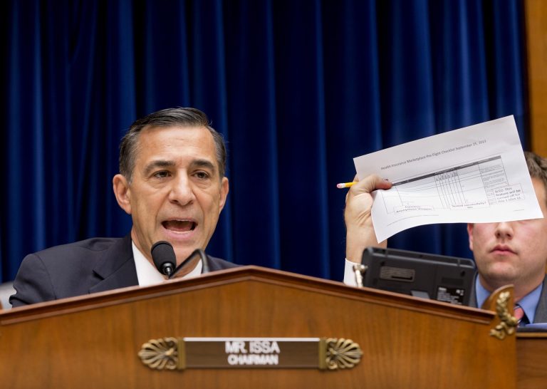 FILE - In this Nov. 13, 2013 file photo, House Oversight Committee Chairman Rep. Darrell Issa, R-Calif., holds up a checklist related to the preparation for the implementation of the Obamacare healthcare program, and specifically, the HealthCare.gov website, on Capitol Hill in Washington. For two months, the talk was all about computer code. About response times. About glitches and bugs. Issa, who misses no opportunity to investigate perceived shortcomings in the health care program, devoted a full hearing to the 