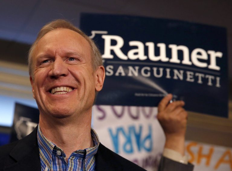 Bruce Rauner smiles at supporters after winning the Republican gubernatorial primary, defeating the field of State Treasurer Dan Rutherford, State Sen. Kirk Dillard, and State Sen. Bill Brady, Tuesday in Chicago. (AP Photo/Charles Rex Arbogast)
