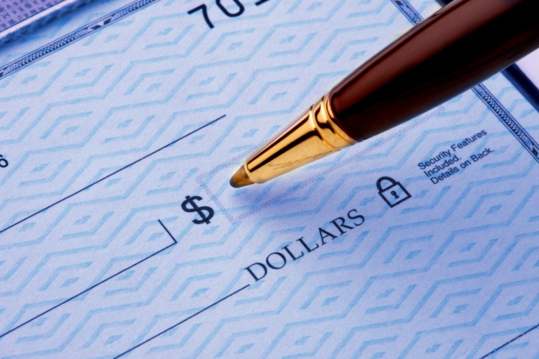 Officials say Kansas City plays a central role in a gang scheme that hires homeless people to cash counterfeit checks. (iStock Image)