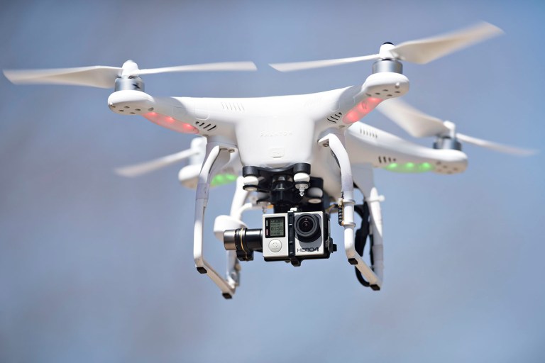 Drone operators must pass a written test and security check; avoid flying over people; fly below 400 feet and stay at least five miles away from airports; and remain within visual sight of their aircraft, according to the rules. (Daniel Acker/Bloomberg, File)