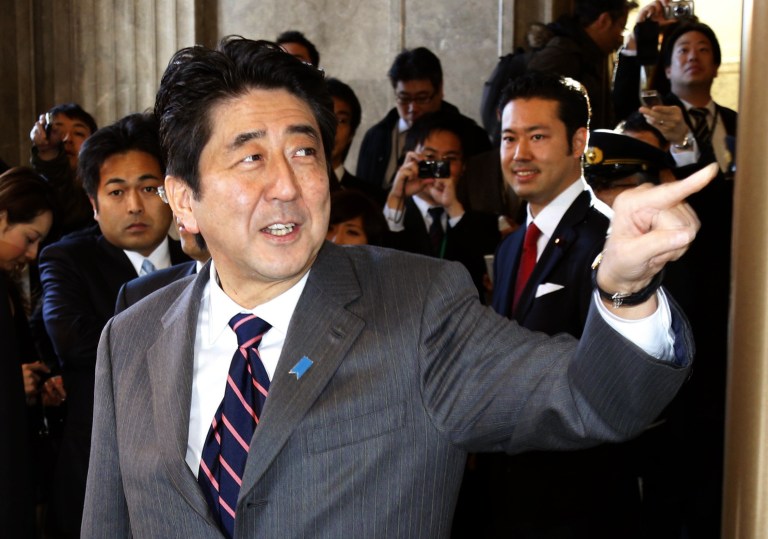   Japan's prime-minister-to-be Shinzo Abe arrives at the parliament for the special diet session in Tokyo, Wednesday, Dec. 26, 2012. Capitalizing on the Democrats' failure to improve the economy and its perceived lack of strong leadership, Abe led the Liberal Democratic Party to victory in parliamentary elections Dec. 16. Abe was to be named prime minister later Wednesday. He was also prime minister in 2006-2007. (AP Photo/Kyodo News) JAPAN OUT, MANDATORY CREDIT, NO LICENSING IN CHINA, HONG KONG, JAPAN, SOUTH KOREA AND FRANCE  