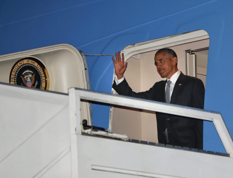President Barack Obama waves from Air Force One during his arrival at Jorge Chavez International Airport in Lima, Peru, Friday, Nov. 18, 2016. Obama traveled to South America to attend the annual Asia-Pacific Economic Cooperation (APEC) forum. (AP Photo/Pablo Martinez Monsivais)