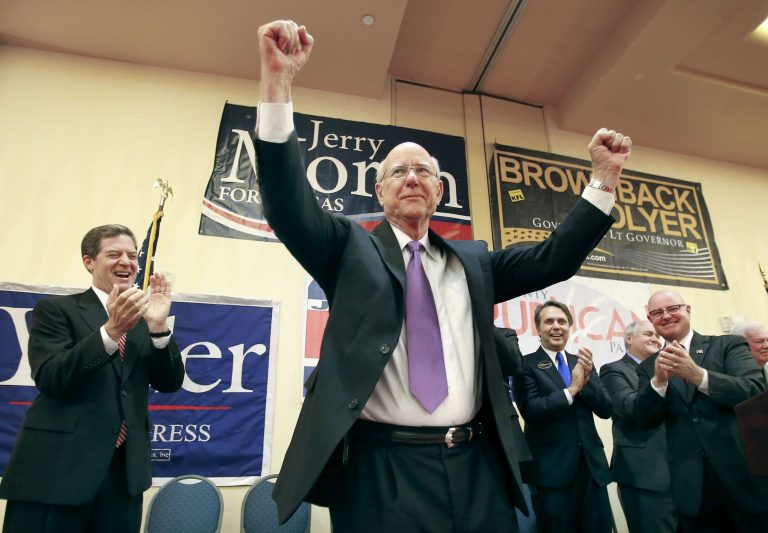 Kansas Sen. Pat Roberts raises his arms in the air as a crowd of supporters cheer for him on Tuesday while watching primary votes come in at the Overland Park, Kan., Marriott Hotel. (AP/Topeka Capital-Journal, Chris Neal)