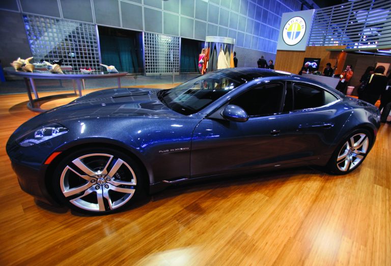 FILE - In this Nov. 18, 2010 file photo, Fisker Automotive's Fisker Karma, a sports luxury plug-in hybrid car, sits on display at the 2010 Los Angeles Auto Show in Los Angeles. Fisker says Saturday, Aug. 18, 2012, it is recalling the Karma sedan to fix cooling fans that can catch fire. (AP Photo/Damian Dovarganes, File)