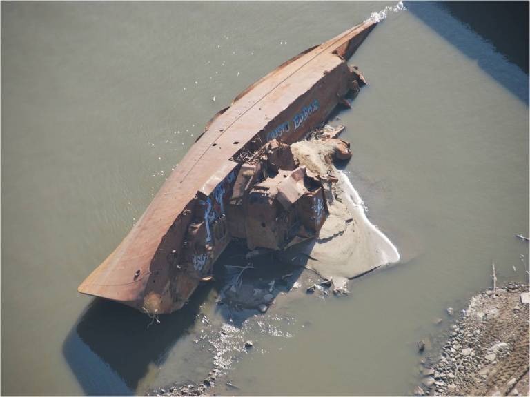   This Nov. 28, 2012 photo provided by The United States Coast Guard shows a WWII minesweeper on the Mississippi River near St. Louis, Mo. The lack of rain has left many rivers at low levels unseen for decades offering a glimpse at things not normally seen. The minesweeper, once moored along the Mississippi River as a museum at St. Louis before it was torn away by floodwaters two decades ago, has become visible _ rusted but intact. (AP Photo/United States Coast Guard, Colby Buchanan)  