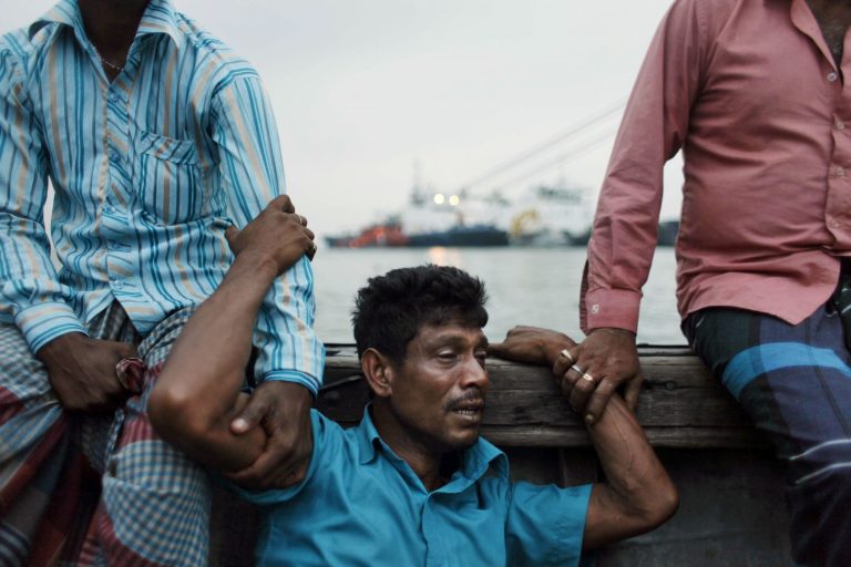 A Bangladeshi man mourns for his missing brother, as rescuers continue to search the site of a ferry that sank, on the banks of the River Meghna in Munshiganj district, in Bangladesh, Friday, May 16, 2014. Rescuers have recovered at least 26 bodies after a ferry capsized during a storm in a river in central Bangladesh, officials said Friday. Police estimated at least 100 people were still missing, but there was no clear picture about exactly how many people were on board because the ferry operators did not maintain a passenger list, said a local administrator, Saiful Hasan. (AP Photo/Suvra Kanti Das)