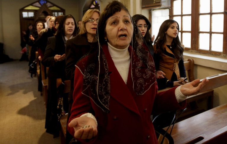 Iraqi Christians pray during a Christmas mass at Virgin Mary Chaldean Church in Baghdad, Iraq, Tuesday, Dec. 25, 2012. (AP File)
