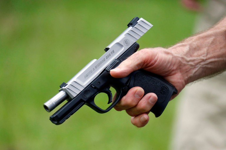 The Defense Department is reducing restrictions on U.S. military service members' ability to carry concealed handguns for protection at government facilities. (AP Photo/Rogelio V. Solis)