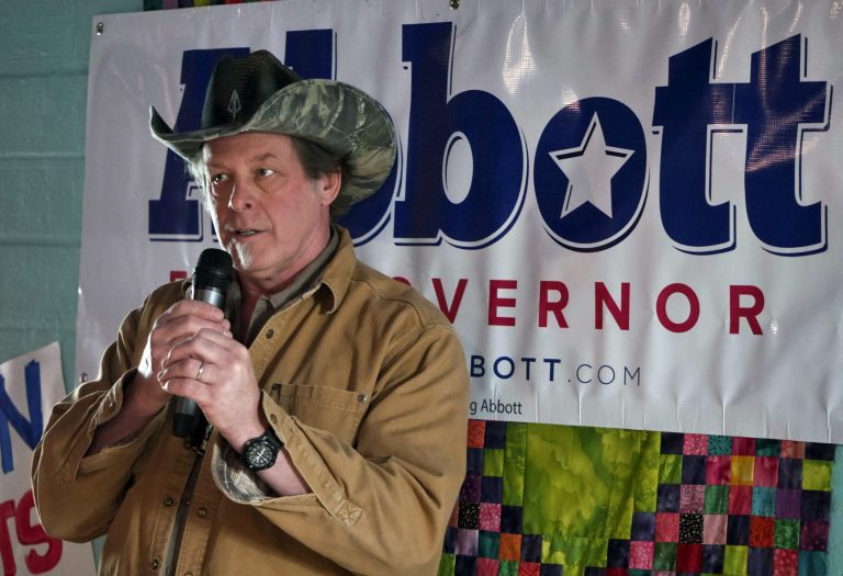 Rocker Ted Nugent introduces Texas gubernatorial candidate Greg Abbott during a campaign stop on Tuesday in Denton, Texas. (AP Photo/The Dallas Morning News, Ron Baselice)