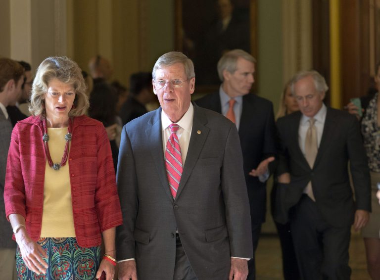 Sen. Lisa Murkowski, R-Alaska, walks with Sen. Johnny Isakson, R-Ga., at the Capitol in Washington. (AP/J. Scott Applewhite)