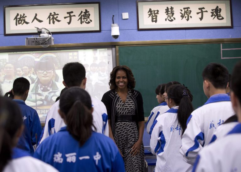 U.S. first lady Michelle Obama meets the students as she visits an English language class at Chengdu No.7 High School in Chengdu in southwestern province of Sichuan, China Tuesday, March 25, 2014. Obama spoke to rural Chinese students via web conferencing Tuesday, at her last stop of the six-day China tour focusing on education and cultural exchange. (AP Photo/Andy Wong)