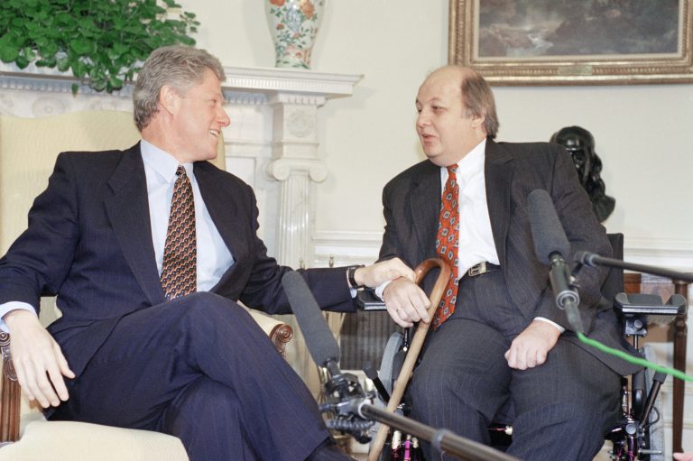 U.S. President Bill Clinton meets with former White House Press Secretary Jim Brady to discuss the Brady gun bill in the Oval Office. Gun control helped sweep in GOP control of House and Senate in 1994. (AP Photo/Dennis Cook)