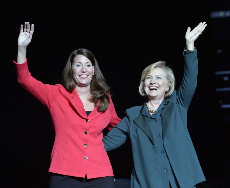 Kentucky democratic senatorial candidate Alison Lundergan Grimes, left, and former Secretary of State Hillary Clinton wave to a group of supporters during a rally in Kentucky. (AP Photo/Timothy D. Easley)