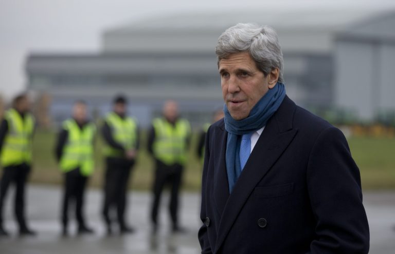 U.S. Secretary of State John Kerry walks across the tarmac as he arrives at London's Stansted Airport, Sunday, Nov. 24, 2013. Kerry is in London to meet with Libyan's Prime Minister Ali Zidan and British Foreign Secretary William Hague. Kerry is traveling from Geneva Switzerland were a deal has been reached between six world powers and Iran that calls on Tehran to limit its nuclear activities in return for sanctions relief, the French and Iranian foreign ministers said early Sunday.(AP Photo/Carolyn Kaster, Pool)