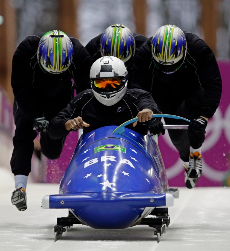 The team from Brazil BRA-1, piloted by Edson Bindilatti, start a run during the men's four-man bobsled training at the 2014 Winter Olympics, Friday, Feb. 21, 2014, in Krasnaya Polyana, Russia. (AP Photo/Dita Alangkara)