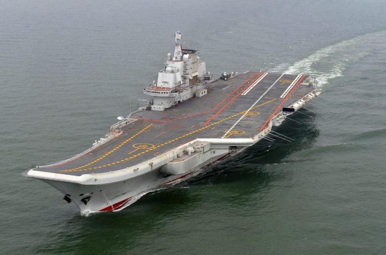 FILE - In this May 2012 file photo provided by China's Xinhua News Agency, Chinese aircraft carrier Liaoning cruises for a test on the sea. Two Chinese test pilots were killed during development of the country's first aircraft carrier fighter wing, state media said, in a rare admission of problems with the hugely popular naval program. The admission came in a report by the official Xinhua News Agency saying President Xi Jinping had signed an order awarding honorary titles to all pilots in the first squadron to conduct take-off and landing tests aboard the Liaoning, China's only aircraft carrier. (AP Photo/Xinhua, Li Tang, File) NO SALES