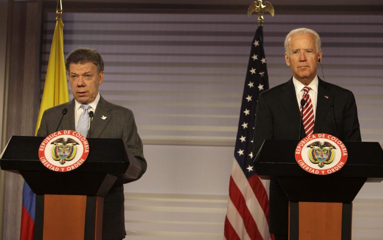 Colombia's President Juan Manuel Santos, left, and U.S. Vice President Joe Biden give a press conference at the presidential palace in Bogota, Colombia, Wednesday, June 18, 2014. Biden met with Santos just three days after Colombia's president won re-election in what was widely seen as an endorsement of talks to end the Western Hemisphere's last sizable armed conflict. (AP Photo/Javier Galeano)