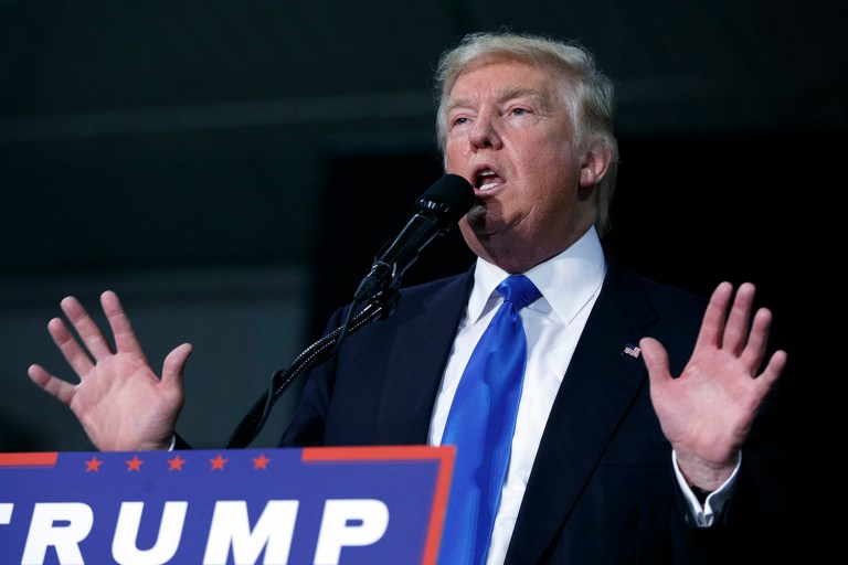 Republican presidential candidate Donald Trump, reacting to former President George H.W. Bush plans to vote for Hillary Clinton, said it's possible he might have decided to vote for Clinton as well if he were in Jeb Bush's shoes. (AP Photo/ Evan Vucci)