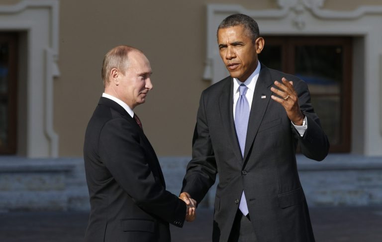 President Obama speaks with Russian President Vladimir Putin during arrivals for the G-20 Summit at the Konstantin Palace in St. Petersburg, Russia, on Sept. 5. (AP Photo/Alexander Zemlianichenko)