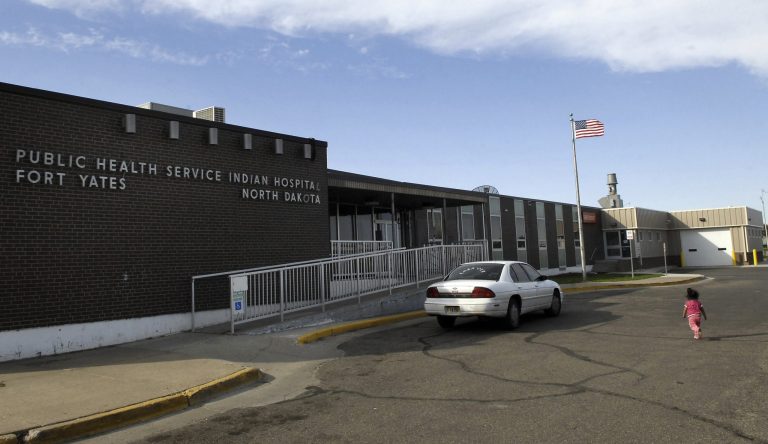 In this 2008 photo, a child walks toward the front door of the Public Health Service Indian Hospital, which is part of the Indian Health Service, on the Standing Rock Reservation in Fort Yates, N.D. A spokeswoman for the Department of Health and Human Services said, 