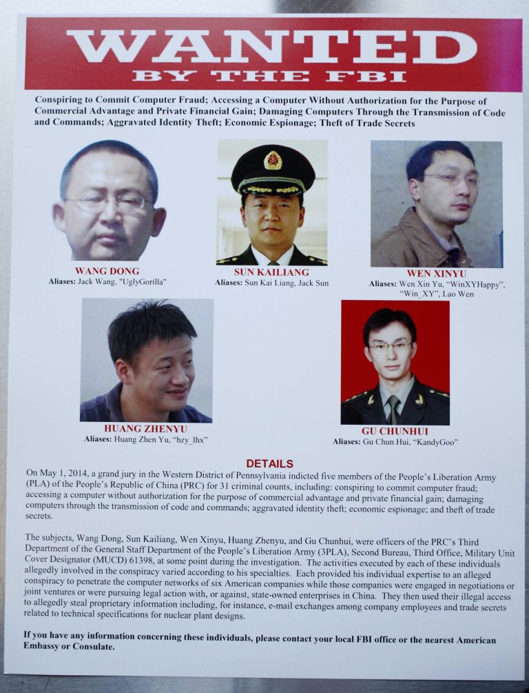 This wanted poster is displayed at the Justice Department in Washington, Monday, May 19, 2014, after Attorney General Eric Holder, Assistant Attorney General for National Security John Carlin, U.S. Attorney for Western District of Pennsylvania David Hickton and FBI Executive Associate Director Robert Anderson participated in a news conference where Holder announced that a U.S. grand jury has charged five Chinese hackers with economic espionage and trade secret theft, the first-of-its-kind criminal charges against Chinese military officials in an international cyber-espionage case. (AP Photo)
