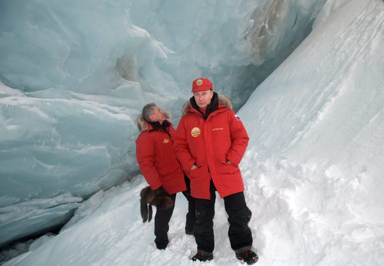Russian President Vladimir Putin, foreground, and Defense Minister Sergei Shoigu, inspect a cavity in a glacier on the Arctic Franz Josef Land archipelago in Arctic Russia, Wednesday, March 29, 2017. Russia has sought to strengthen its foothold in the Arctic amid intensifying rivalry for the region's rich natural resources between polar countries.(Alexei Druzhinin, Sputnik, Kremlin Pool Photo via AP)