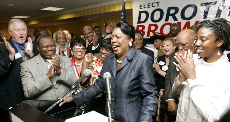 Cook County Circuit Court Clerk Dorothy Brown is applauded by supporters during a news conference in 2006. (AP Photo/Charles Rex Arbogast)