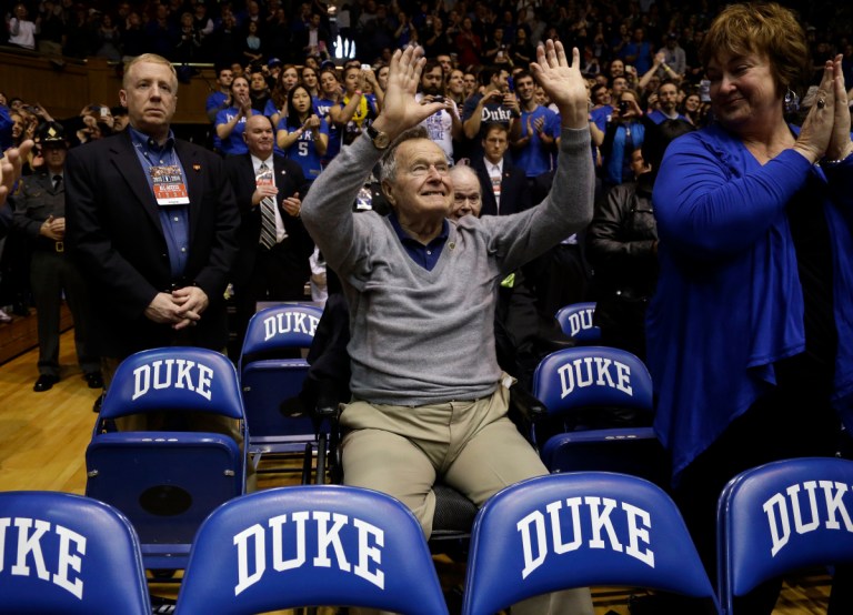 Former president George H.W. Bush is introduced at the Duke vs. North Carolina State men's basketball game. (Gerry Broome, AP)
