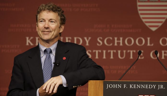 Sen. Rand Paul, R-Ky. smiles as he listens to a question during his public address at the John F. Kennedy Jr. Forum Institute of Politics at the Harvard Kennedy School, Friday April 25, 2014, in Cambridge, Mass. Fighting to move beyond his father's shadow, Paul is crafting new alliances with the Republican Party establishment during a Northeast tour that began Friday in Boston.  The 51-year-old Kentucky Republican, son of libertarian hero and former Texas Rep. Ron Paul, headlined an afternoon luncheon hosted by top lieutenants of former presidential nominee Mitt Romney _ a private meeting that comes as Paul weighs a 2016 presidential bid of his own.