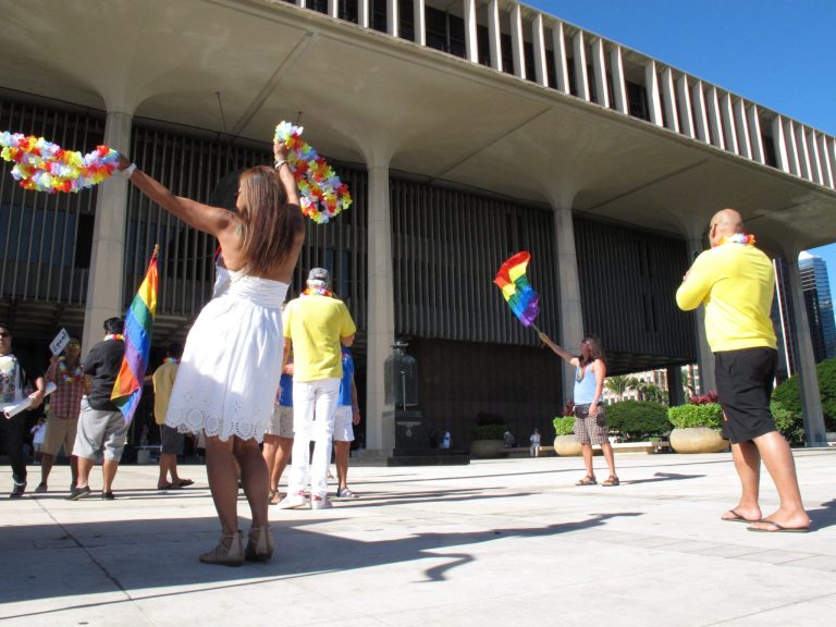 Gay marriage supporters rally outside the Capitol building in Honolulu, H.I., ahead of a Tuesday Senate vote on whether to legalize same-sex marriage. The measure passed. (AP Photo/Oskar Garcia)