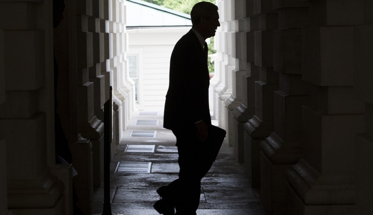 The silhouette of Robert Mueller, former director of the Federal Bureau of Investigation (FBI) and special counsel for the U.S. Department of Justice, is seen as he leaves the U.S. Capitol Building following a meeting with the Senate Judiciary Committee in Washington, D.C., U.S., on Tuesday, June 20, 2017. Senators on the Intelligence Committee pressed administration officials Wednesday to disclose more about the extent of Russian hacking attempts during last year's election after the government disclosed that 21 states had been targeted.