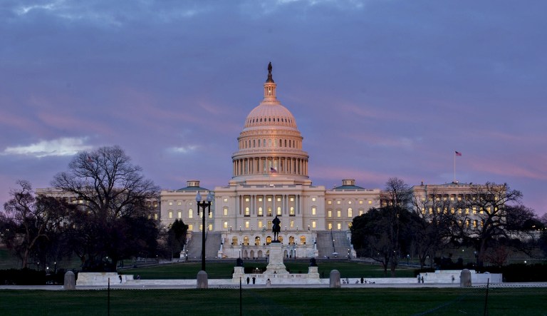 The U.S. Capitol stands at sunset in Washington, D.C.