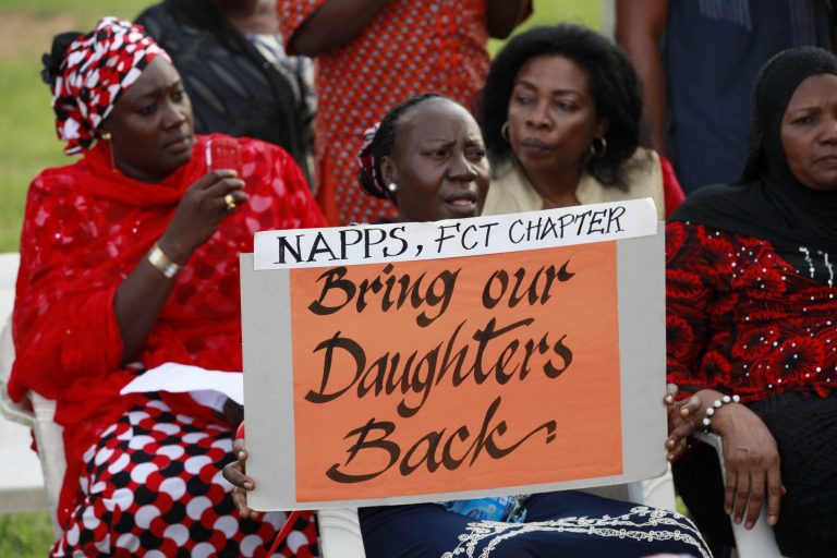 Women attend a sit down rally calling on the government to rescue the kidnapped school girls of the Chibok secondary school, in Abuja, Nigeria, Thursday, May 15, 2014. Islamic militants again attacked the remote Nigerian town from which nearly 300 schoolgirls were kidnapped, Nigeria's military said Wednesday, resulting in a firefight that killed 12 soldiers and led angry troops to fire into the air when their commanding officer came to pay respects to those killed at a barracks in Maiduguri, the state capital.  (AP Photo/Sunday Alamba)