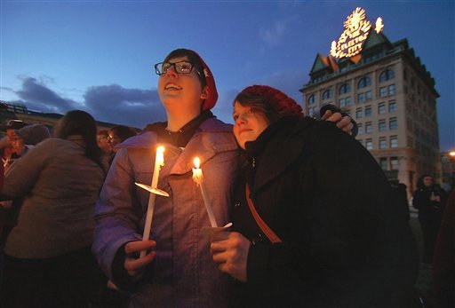 Megan McGraw, 24, of Dunmore, Pa. left, and Kristi Greider, 24, of Scranton, Pa. take part during a Scranton Candlelight Vigil for Marriage Equality in advance of the Supreme Court DOMA decision held on Tuesday, March 26, 2013 at the Lackawanna County Courthouse Square in downtown Scranton, Pa. (AP Photo/The Scranton Times-Tribune, Butch Comegys)